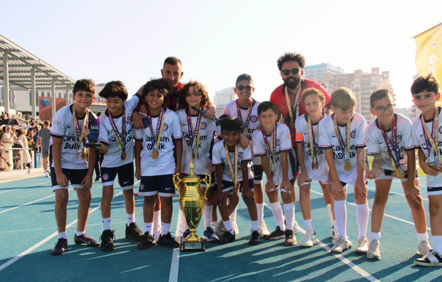 EPIC squad players celebrating with their trophy